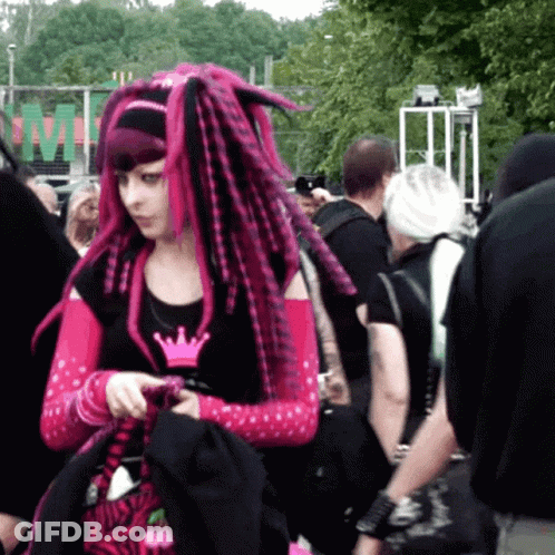 Woman With Pink Dreadlocks Standing In Crowd GIF