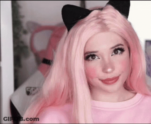 Woman With Pink Hair And Cat Ears In Pink Sweater GIF