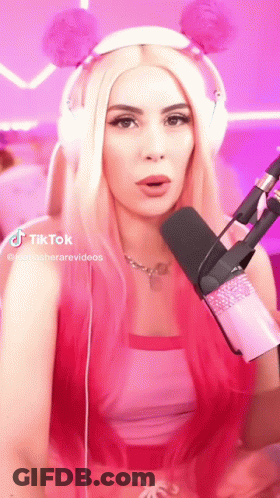 Woman With Pink Hair And Headphones At Pink Microphone GIF