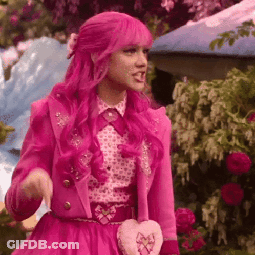 Woman With Pink Hair And Pink Jacket Holding Heart Purse GIF