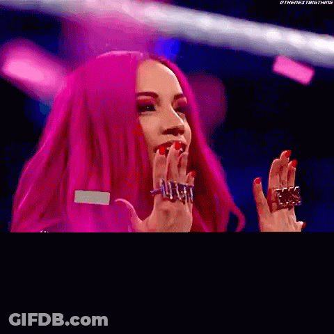 Woman With Pink Hair And Rings At Microphone GIF
