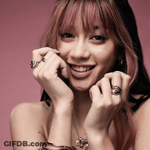 Woman With Pink Hair And Rings GIF