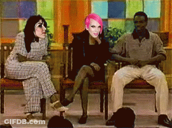 Woman With Pink Hair Between Two Men GIF