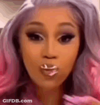 Woman With Pink Hair Blowing Kiss With Toothpick GIF