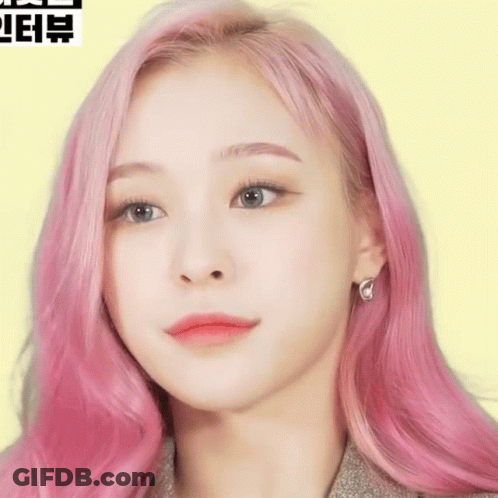 Woman With Pink Hair Close Up On Yellow Background GIF