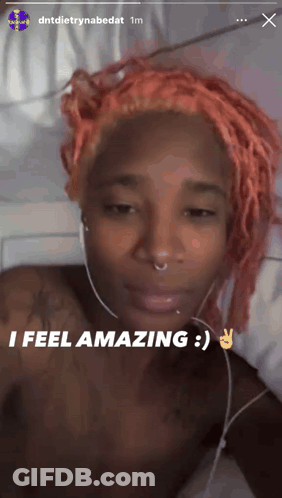 Woman With Pink Hair Headphones Saying I Feel Amazing GIF