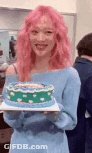 Woman With Pink Hair Holding Cake GIF