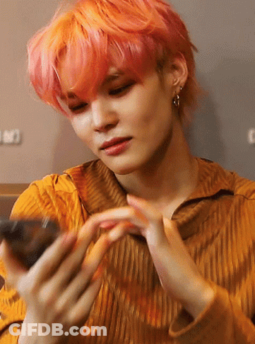 Woman With Pink Hair Holding Cell Phone GIF