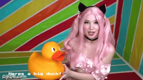 Woman With Pink Hair Holding Rubber Duck Saying Heres A Big Duck GIF