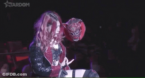 Woman With Pink Hair Holding Tiger Mask Flipping Off GIF