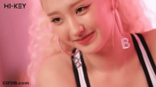 Woman With Pink Hair Hoop Earrings And B Necklace GIF
