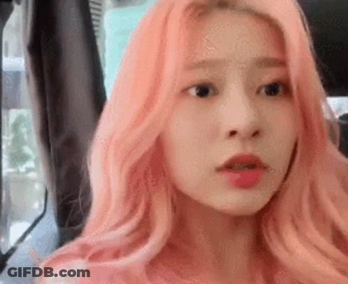 Woman With Pink Hair In Back Seat Of Car GIF