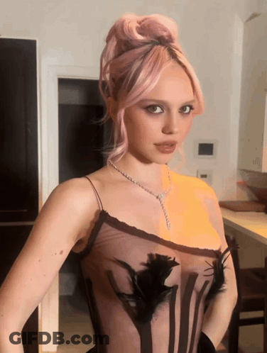 Woman With Pink Hair In Black Dress GIF