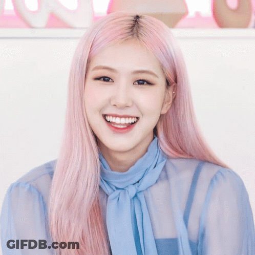 Woman With Pink Hair In Blue Shirt And Tie Smiling GIF