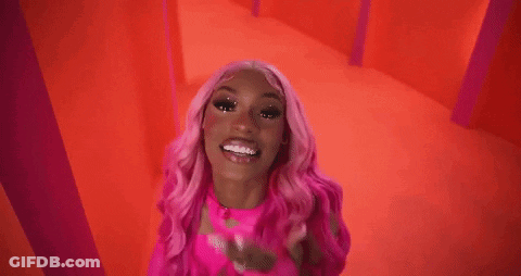 Woman With Pink Hair In Pink Top And Gloves GIF