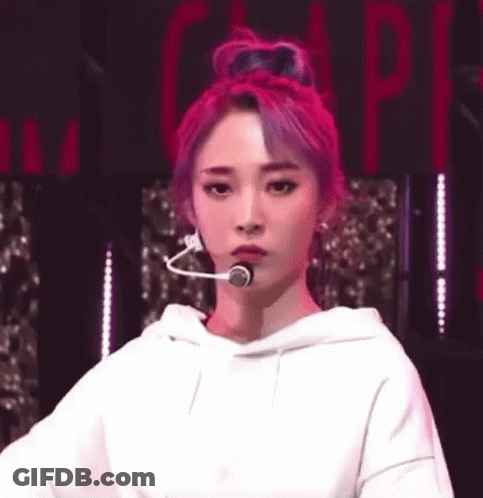Woman With Pink Hair In White Hoodie And Head Microphone GIF