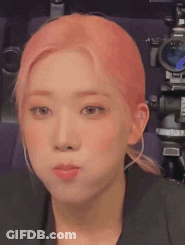 Woman With Pink Hair Making Face GIF