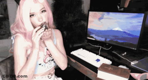 Woman With Pink Hair Sitting At Computer GIF