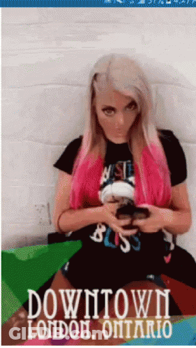 Woman With Pink Hair Sitting On Couch Downtown London Ontario GIF