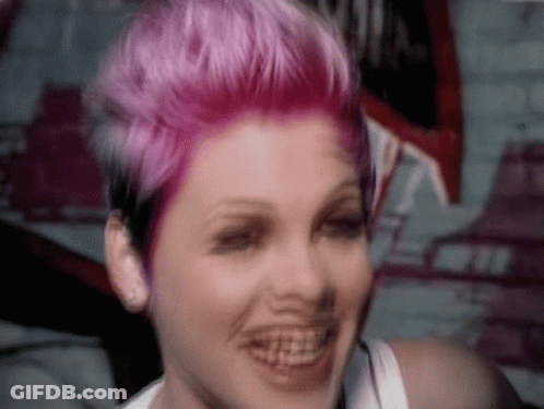 Woman With Pink Hair Smiling With Braces GIF
