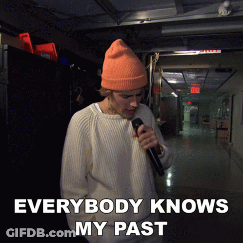 Woman With Pink Hair Standing In Front Of 666 Sign GIF