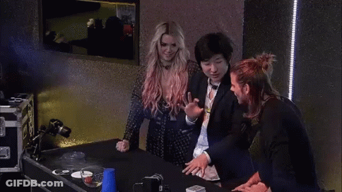Woman With Pink Hair Standing Next To Two People GIF