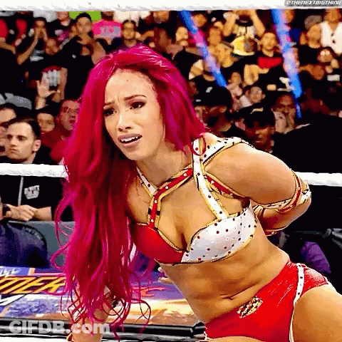 Woman With Pink Hair Tied Up In Wrestling Ring GIF