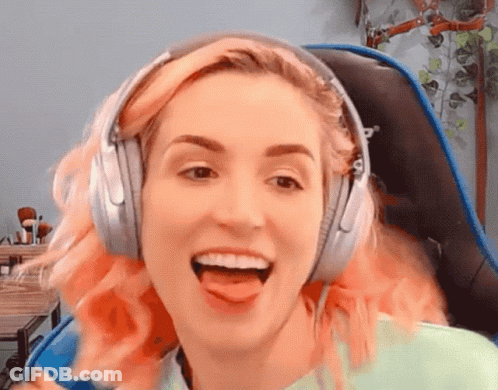 Woman With Pink Hair Wearing Headphones Sticking Tongue Out GIF