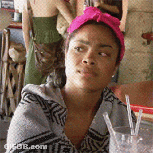 Woman With Pink Headband Looking At Camera GIF