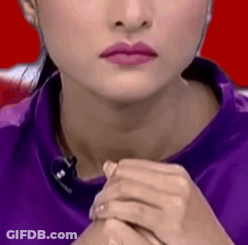 Woman With Pink Lipstick And Purple Shirt GIF