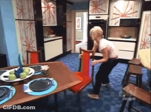 Woman With Plate Of Apples Beside Red Chair GIF