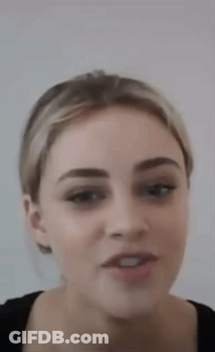 Woman With Ponytail And Black Shirt GIF