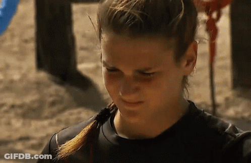 Woman With Ponytail And Black Shirt On Sand GIF