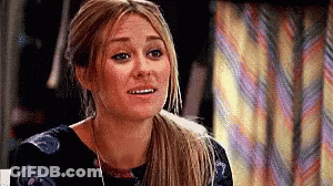 Woman With Ponytail And Striped Curtain GIF