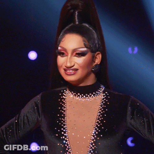 Woman With Ponytail In Black Dress With Sequins GIF
