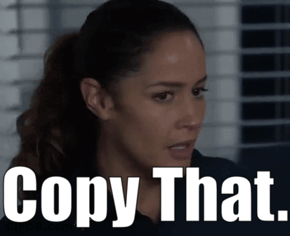 Woman With Ponytail Next To Copy That Sign GIF