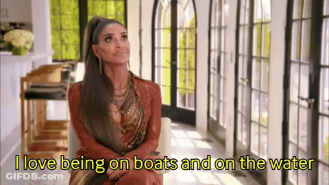 Woman With Ponytail Saying I Love Being On Boats And On The Water GIF