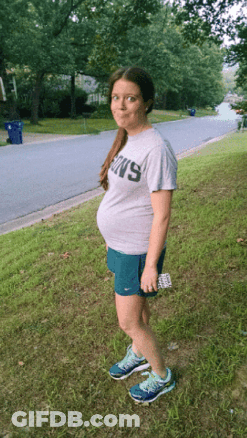 Woman With Pregnant Belly Jogs GIF