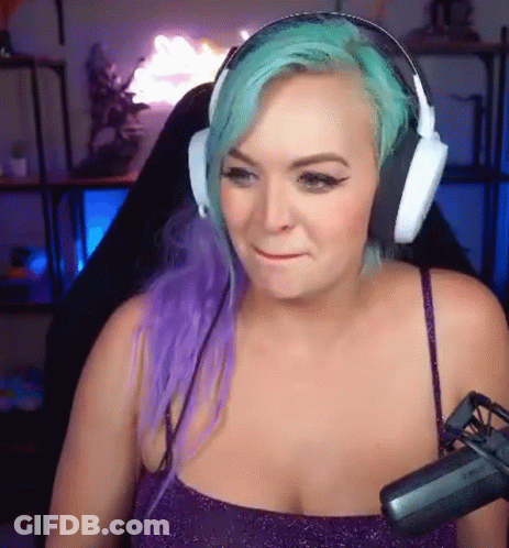 Woman With Purple And Green Hair Wearing Headphones And Microphone GIF