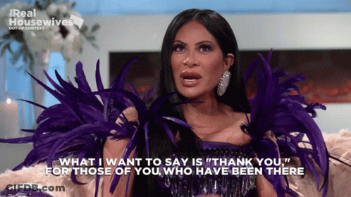 Woman With Purple Feathers Saying Thank You GIF