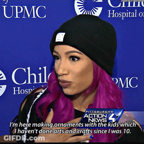 Woman With Purple Hair And Black Beanie Making Ornaments GIF