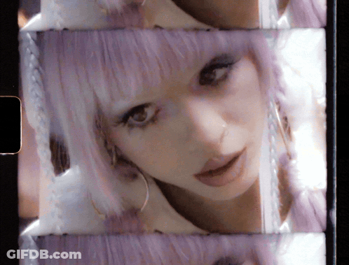 Woman With Purple Hair And Earrings GIF