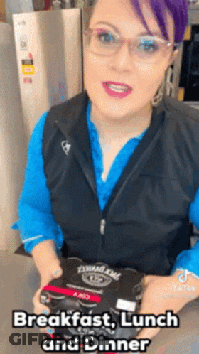 Woman With Purple Hair And Glasses Holding Food Box GIF