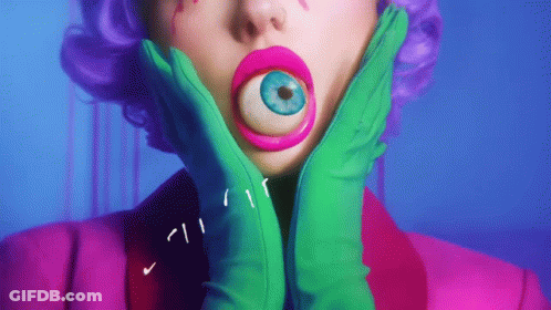 Woman With Purple Hair And Green Gloves Holding Face GIF