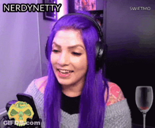 Woman With Purple Hair And Headphones Smiling At Phone GIF