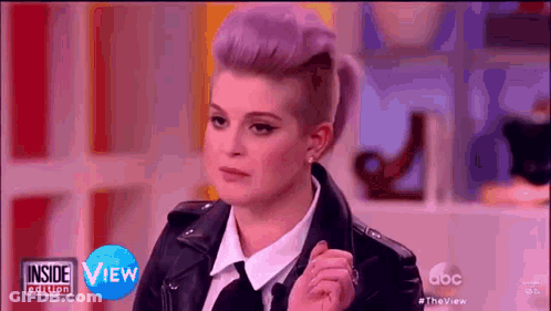 Woman With Purple Hair And Leather Jacket GIF