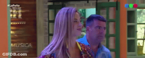 Woman With Purple Hair And Man At La Pena Sign GIF