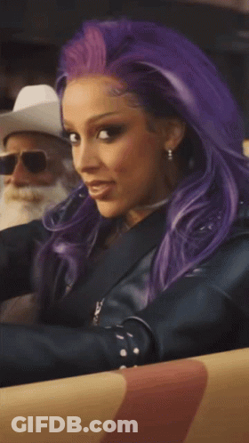Woman With Purple Hair And Man In Cowboy Hat GIF