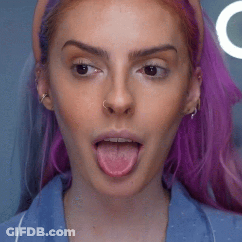 Woman With Purple Hair And Nose Ring Sticking Tongue Out GIF