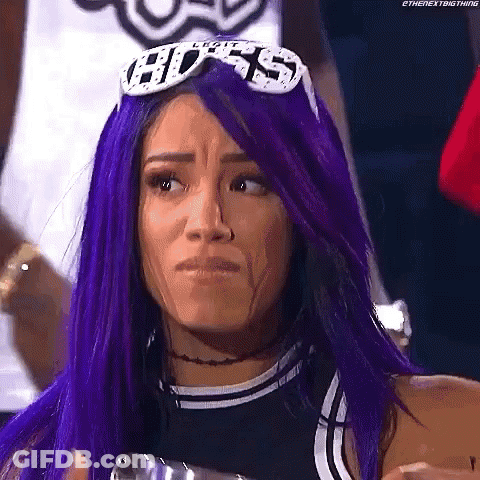 Woman With Purple Hair And Sunglasses Making A Face GIF